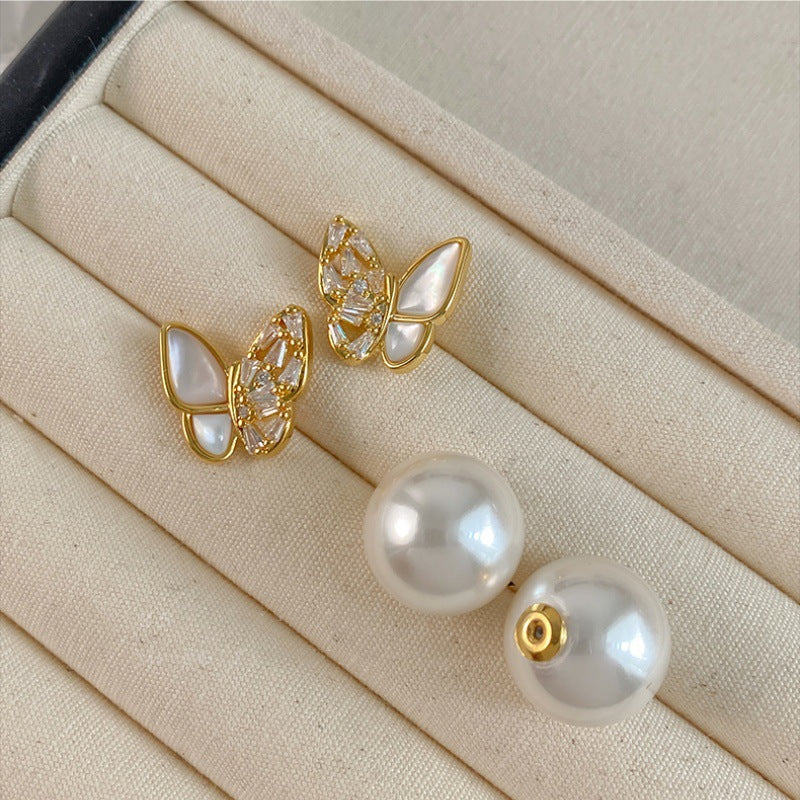 Butterfly studs and pearl backs shown apart