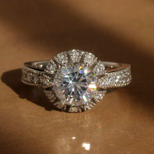 Silver sunflower halo pavé ring