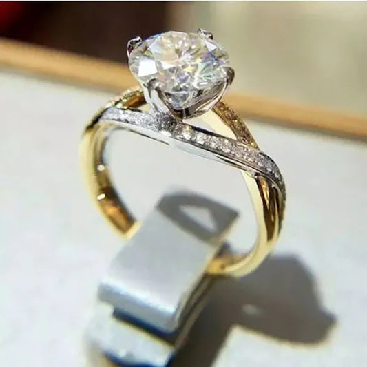 Two-tone twisted pavé solitaire ring