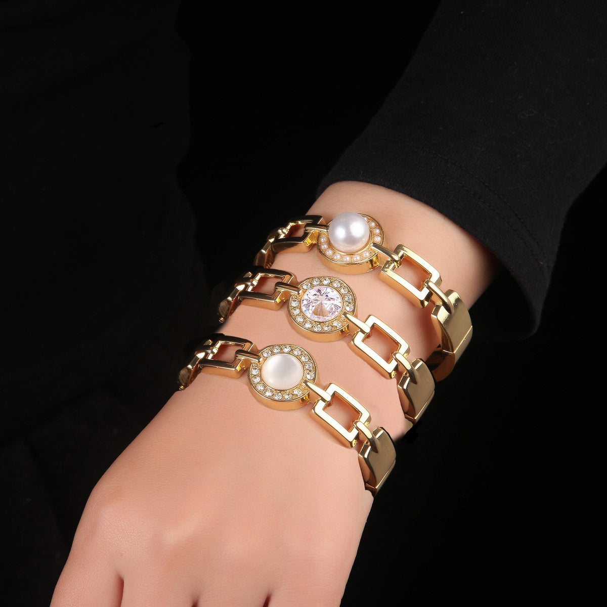All three chain-link halo bangles stacked