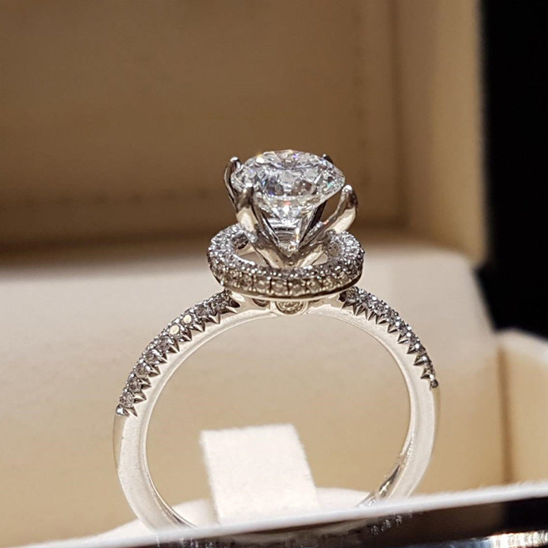 Silver round solitaire hidden halo pavé ring
