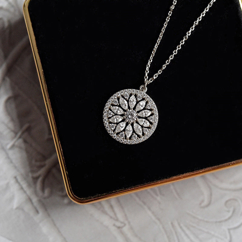 Silver sunburst medallion close-up