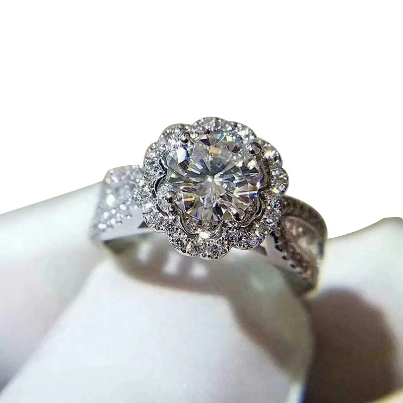 Round halo pavé ring on white