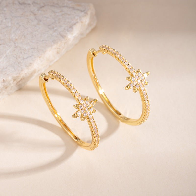 Gold north star pavé hoop earrings