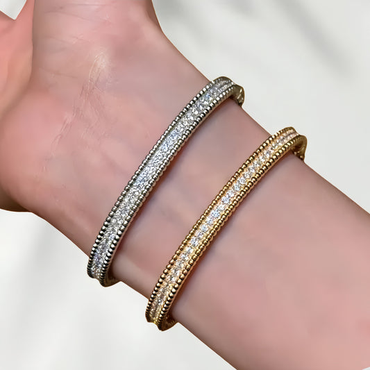 Beaded edge pavé bangle worn on the wrist